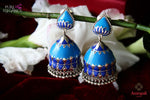 Shop Amrapali silver blue enamel jhumka earrings online in USA. Find an exquisite collection of handcrafted Indian jewelry in USA at Pure Elegance Indian fashion store. Complete your festive look with beautiful silver gold plated necklaces, silver gold plated earrings, silver jewelry from our online store.-flatlay