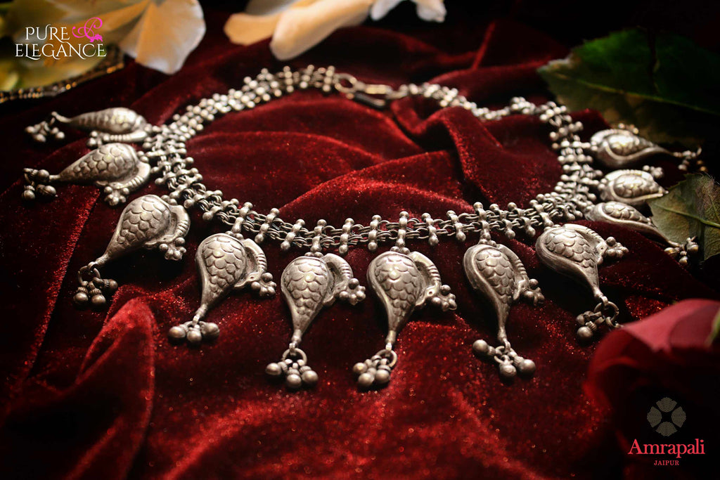 Shop Silver Peacock Motifs Choker Necklace online in USA from Amrapali.  If you are looking for Indian silver jewelry in USA, then Pure Elegance Indian fashion store is the place for you. A whole range of exquisite of ethnic Indian jewelry is waiting for you on our shelves, you can also opt to shop online.-flat lay