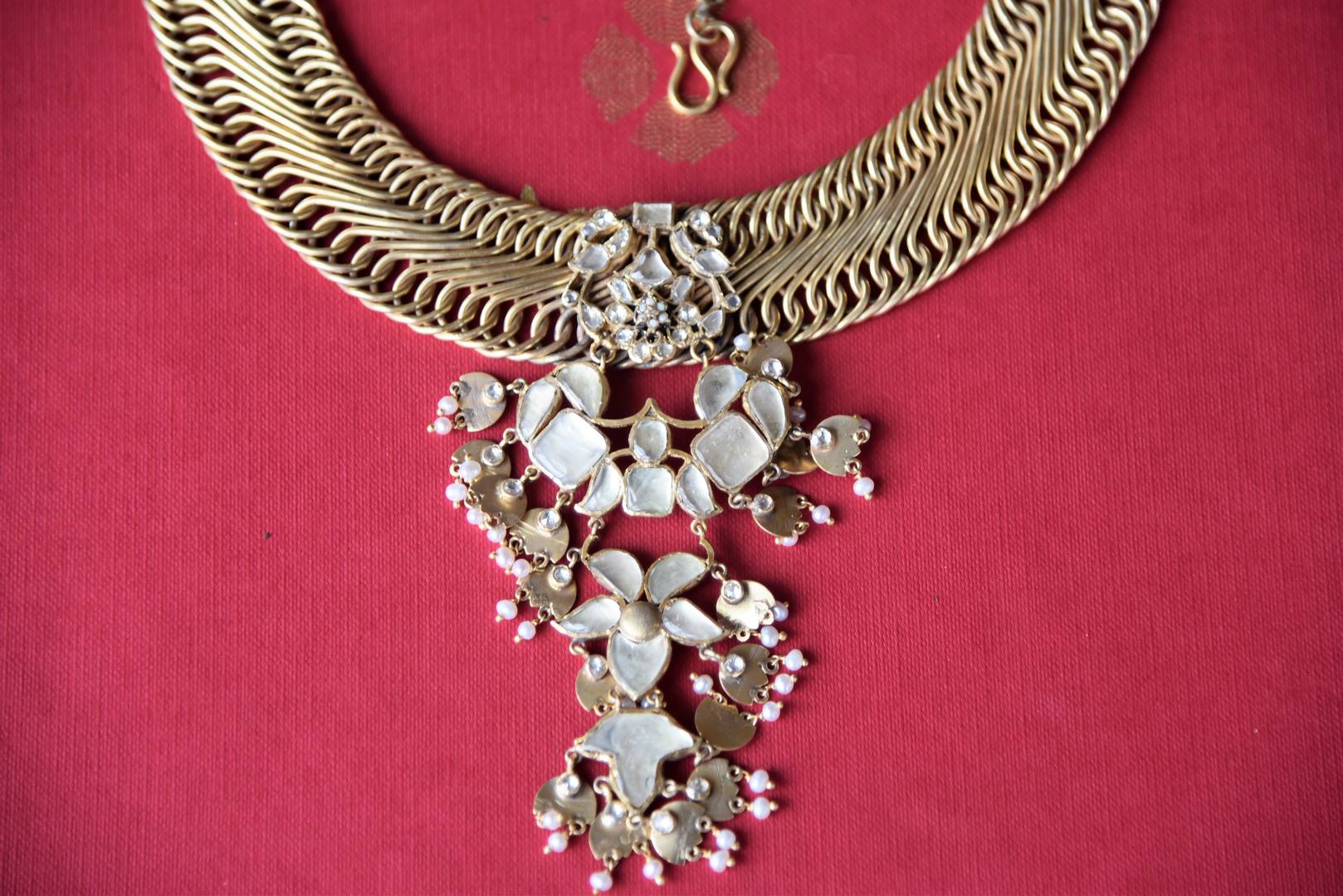 Shop silver gold plated necklace by Amrapali online in USA with floral design glass pendant. Get festival ready with a range of exquisite handcrafted Indian silver gold plated jewelry from Pure Elegance Indian clothing store in USA.-closeup