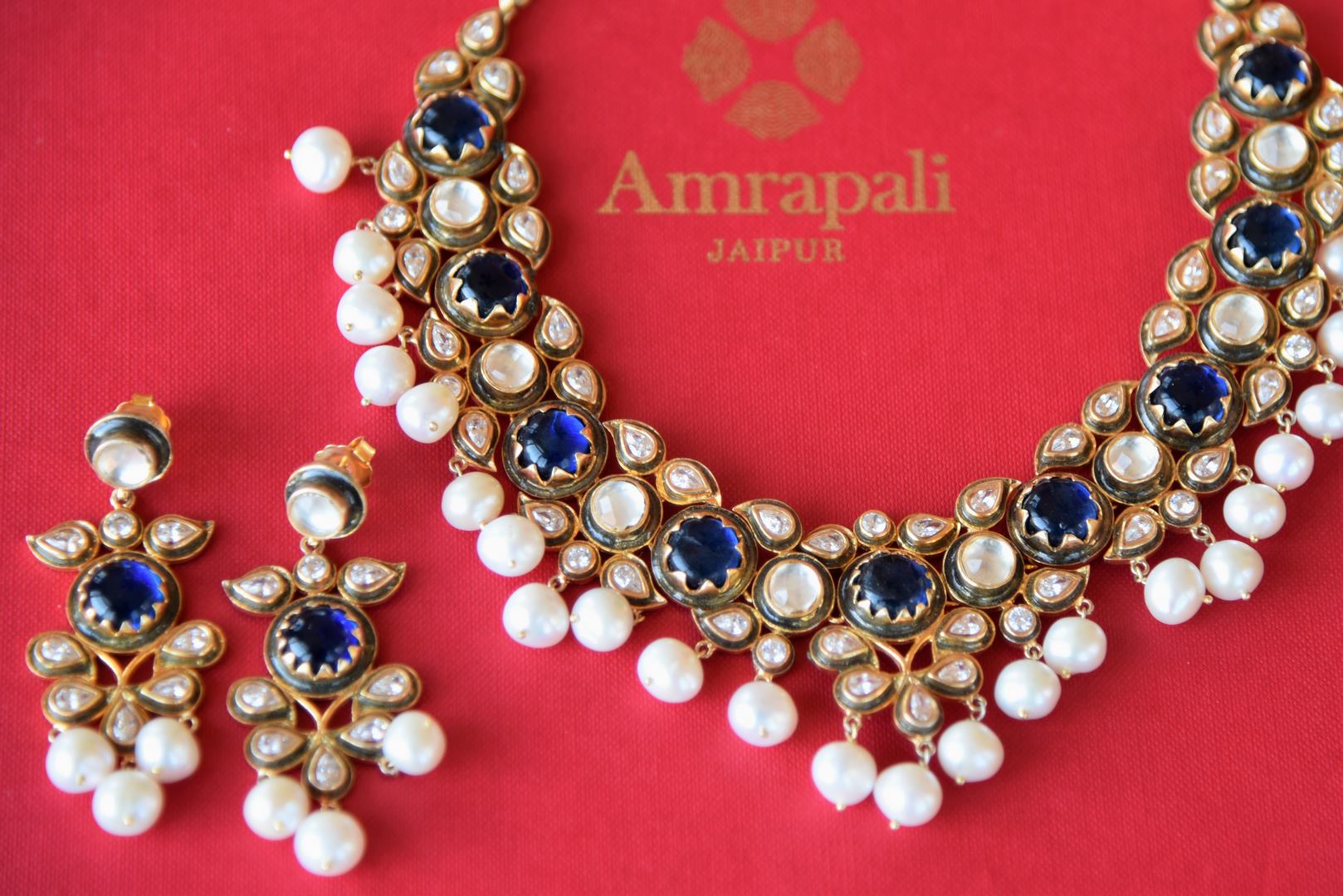Buy silver gold plated Amrapali glass and pearl necklace set with earrings online in USA. Add spark to your ethnic attires with beautiful Indian jewelry, wedding jewelry, silver gold plated necklaces from Pure Elegance Indian fashion store in USA.-flatlay