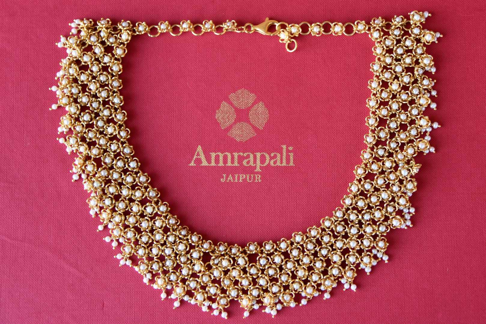 Shop Amrapali silver gold plated pearl necklace online in USA. Add spark to your ethnic attires with beautiful Indian silver gold plated jewelry, wedding jewelry, silver gold plated necklaces from Pure Elegance Indian fashion store in USA.-flatlay