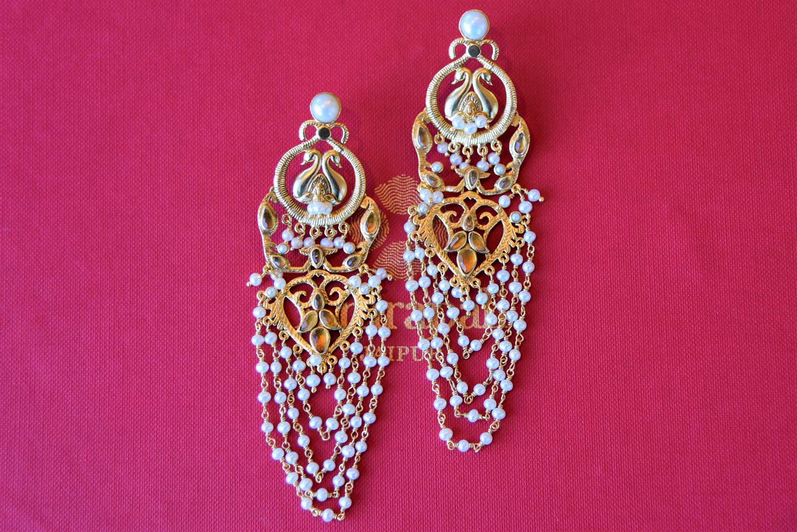 Buy Amrapali beautiful silver gold plated citrine earrings online in USA with looped pearl tassels. Add spark to your ethnic attires with beautiful Indian silver gold plated jewelry, wedding jewelry, silver gold plated necklaces from Pure Elegance Indian fashion store in USA.-flatlay
