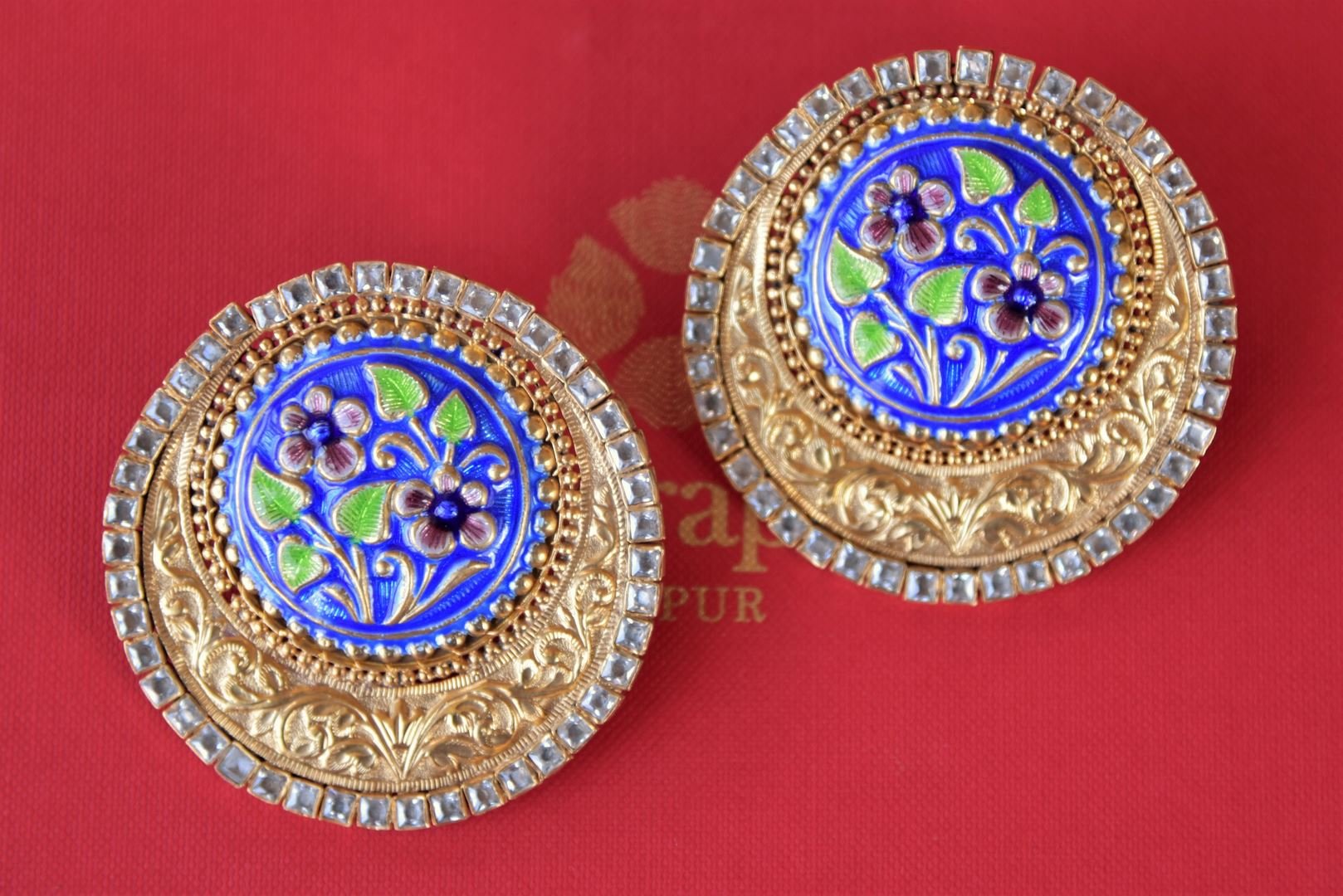 Buy silver gold plated enamel glass engraved Amrapali stud earrings online in USA. Enhance your ethnic style with exquisite Indian jewelry from Pure Elegance Indian fashion store in USA. Pick from a range of stunning silver gold plated earrings, silver gold plated necklaces, silver jewelry for a perfect finishing...-front