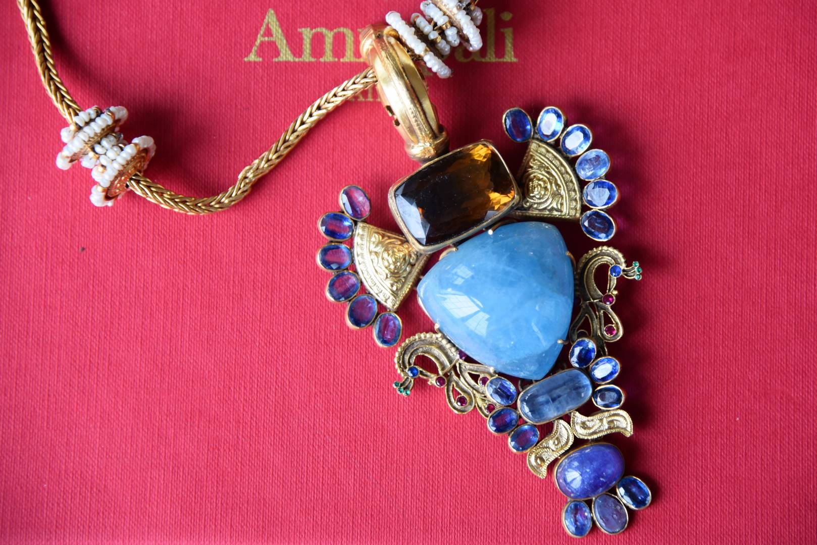 Shop silver gold plated Amrapali blue glass pendant necklace online in USA. Get festival ready with a range of exquisite handcrafted Indian silver gold plated jewellery, ethnic silver jewelry from Pure Elegance Indian clothing store in USA.-flatlay