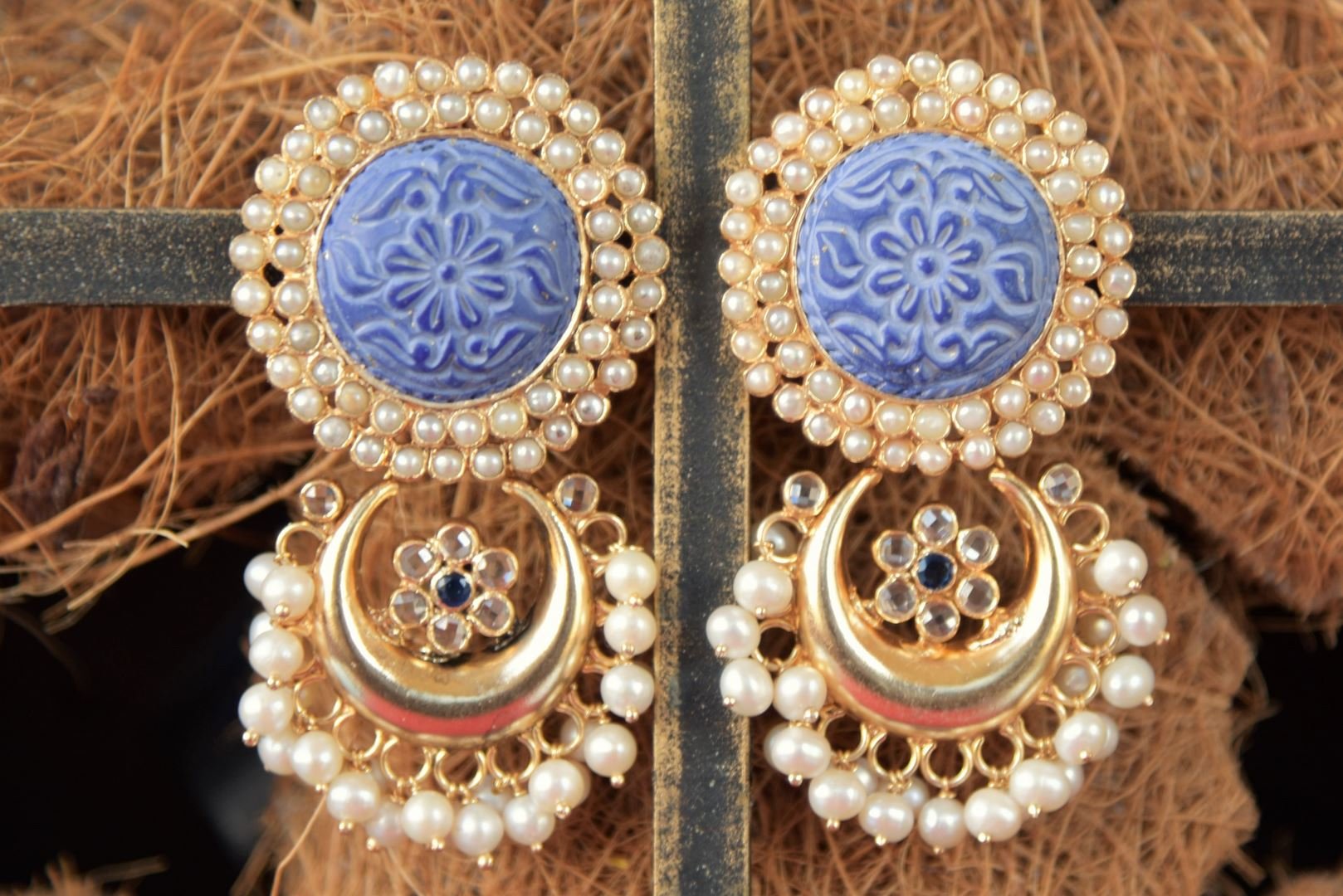Shop beautiful Amrapali gold plated earrings online in USA with engraved blue stone and pearls. Enhance your ethnic style with exquisite Indian jewelry from Pure Elegance Indian fashion store in USA. Pick from a range of stunning silver gold plated earrings, silver gold plated necklaces, silver jewelry for a perfect...-front