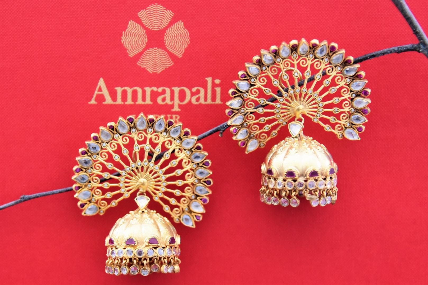 Shop Amrapali silver gold plated open peacock feather design jhumka earrings online in USA. Find an exquisite collection of handcrafted Indian jewelry in USA at Pure Elegance Indian fashion store. Complete your festive look with beautiful silver gold plated necklaces, silver gold plated earrings, silver jewelry from our online store.-front