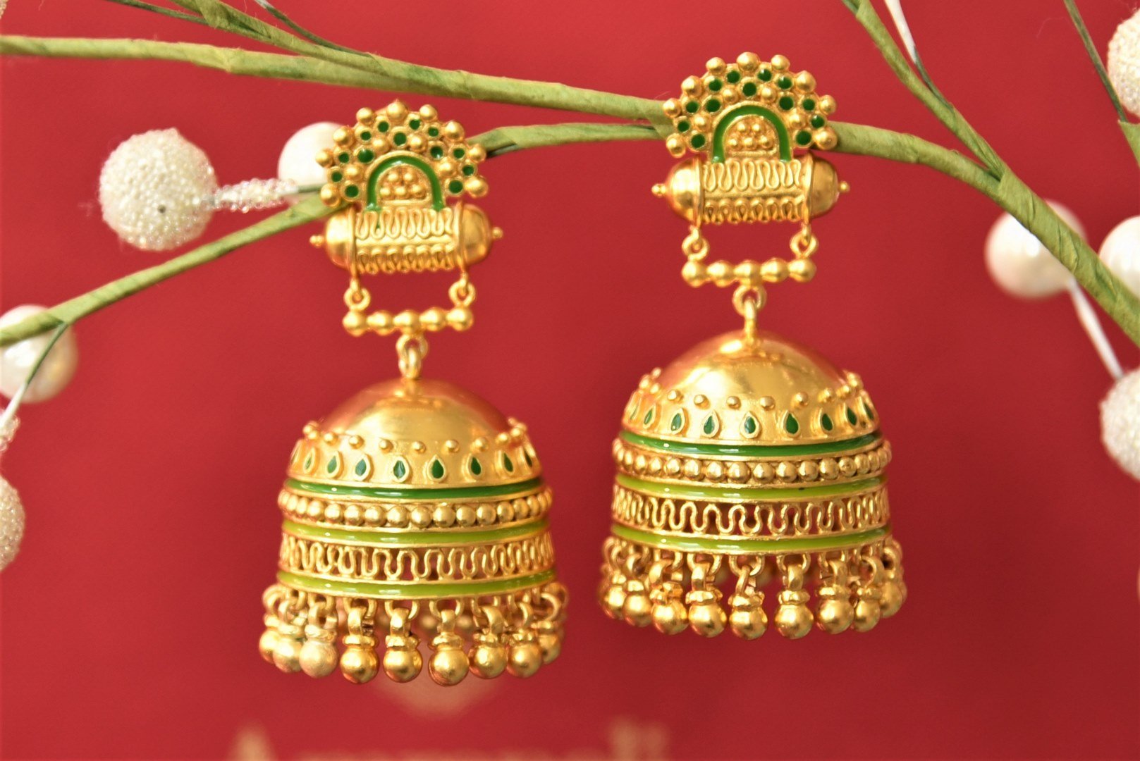 Shop Amrapali green enamel silver gold plated jhumki online in USA. Complete your traditional style with exquisite silver gold plated jewelry from Pure Elegance Indian fashion store in USA.-front