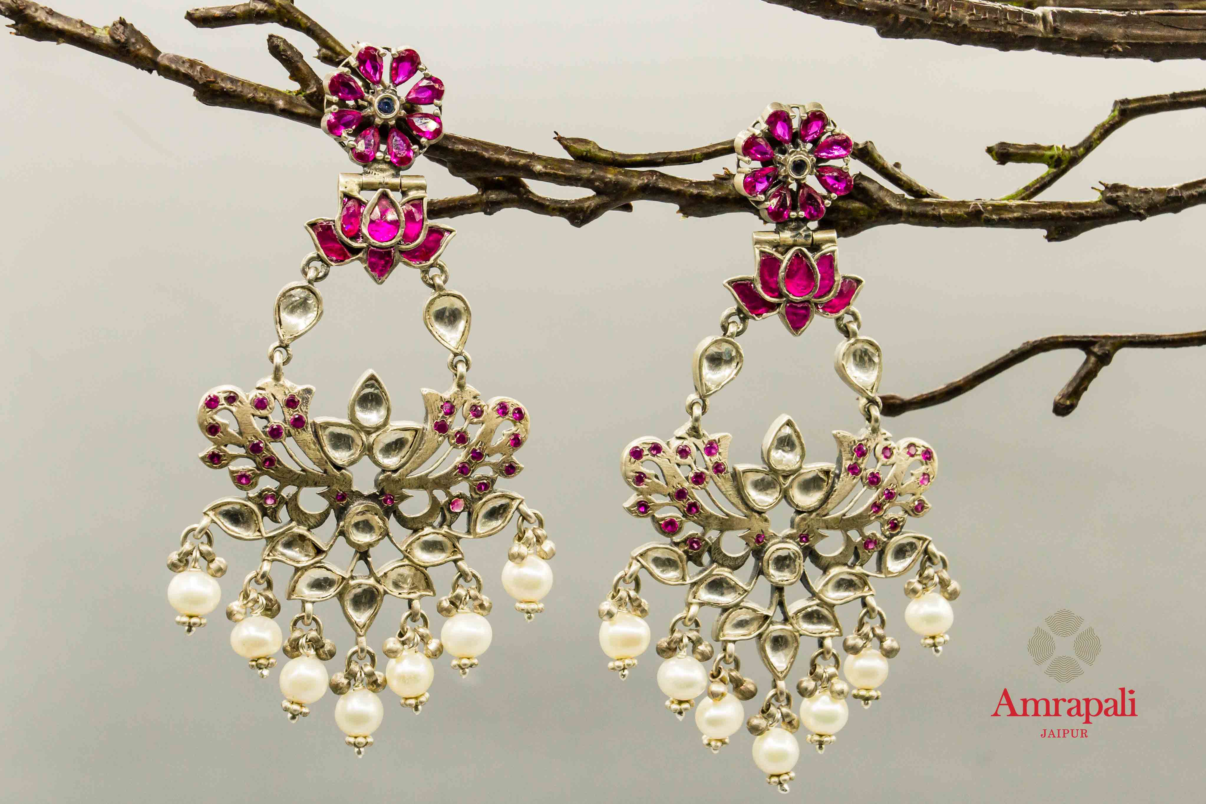 Shop Amrapali pink glass silver earrings online in USA with pearl drops. Raise your traditional fashion quotient on special occasions with exquisite Indian jewelry from Pure Elegance Indian clothing store in USA. Enhance your look with silver gold plated jewelry, silver jewelry available online.-front