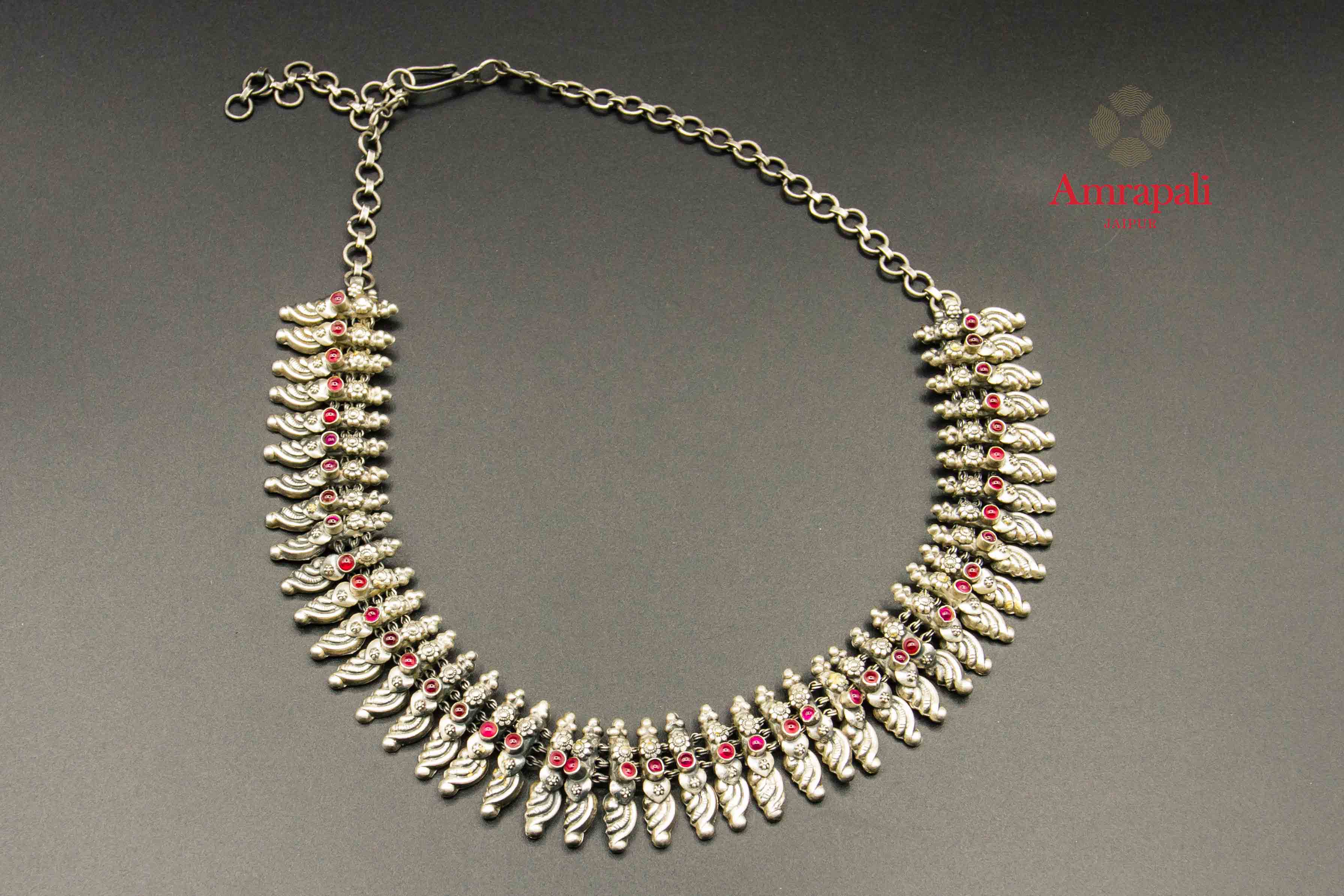 Shop Amrapali ethnic pink stone silver necklace online in USA. Raise your traditional fashion quotient on special occasions with exquisite Indian jewelry from Pure Elegance Indian clothing store in USA. Enhance your look with silver gold plated jewelry, silver jewellery available online.-flatlay