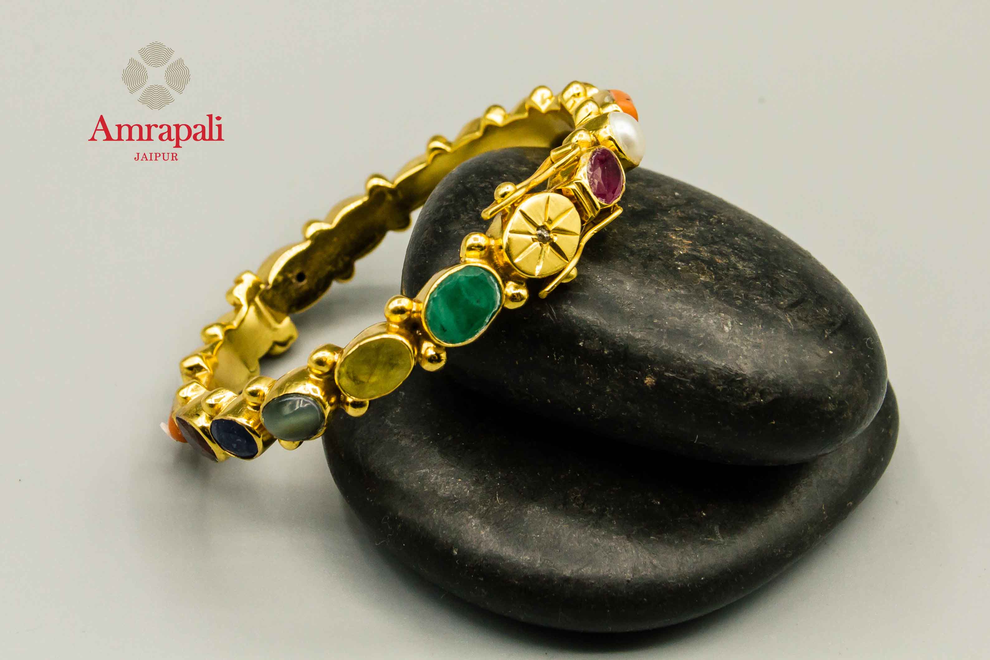 Buy Amrapali multicolored stone silver gold plated bangle online in USA. Raise your traditional fashion quotient on special occasions with exquisite Indian jewelry from Pure Elegance Indian clothing store in USA. Enhance your look with silver gold plated jewelry, silver jewellery available online.-flatlay