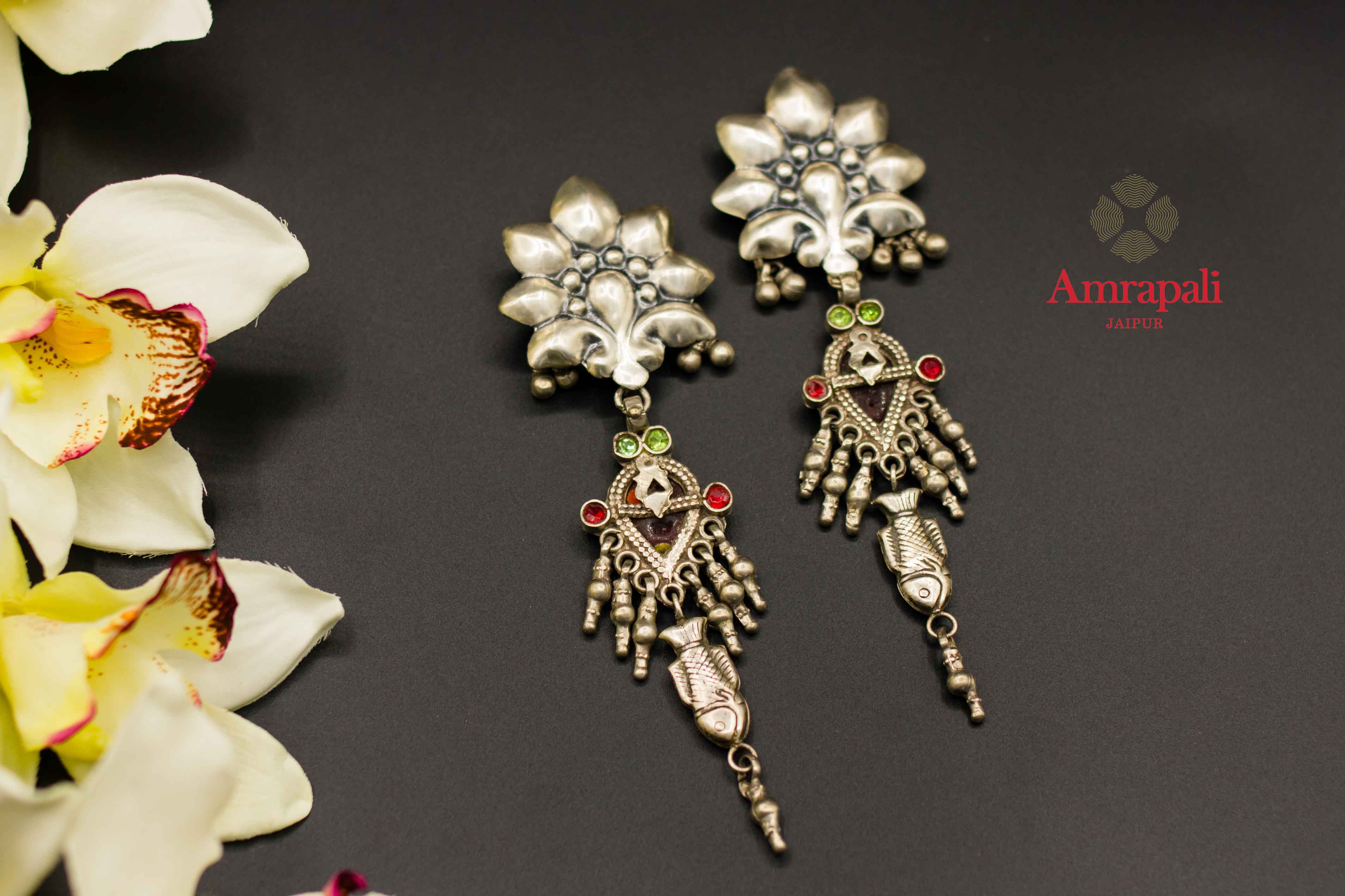 Buy Amrapali flower top silver earrings online in USA with colored stones. Raise your ethnic style quotient on special occasions with exquisite Indian jewelry from Pure Elegance Indian clothing store in USA. Enhance your Indian look with silver gold plated jewelry, necklaces, silver jewelry available online.-flatlay
