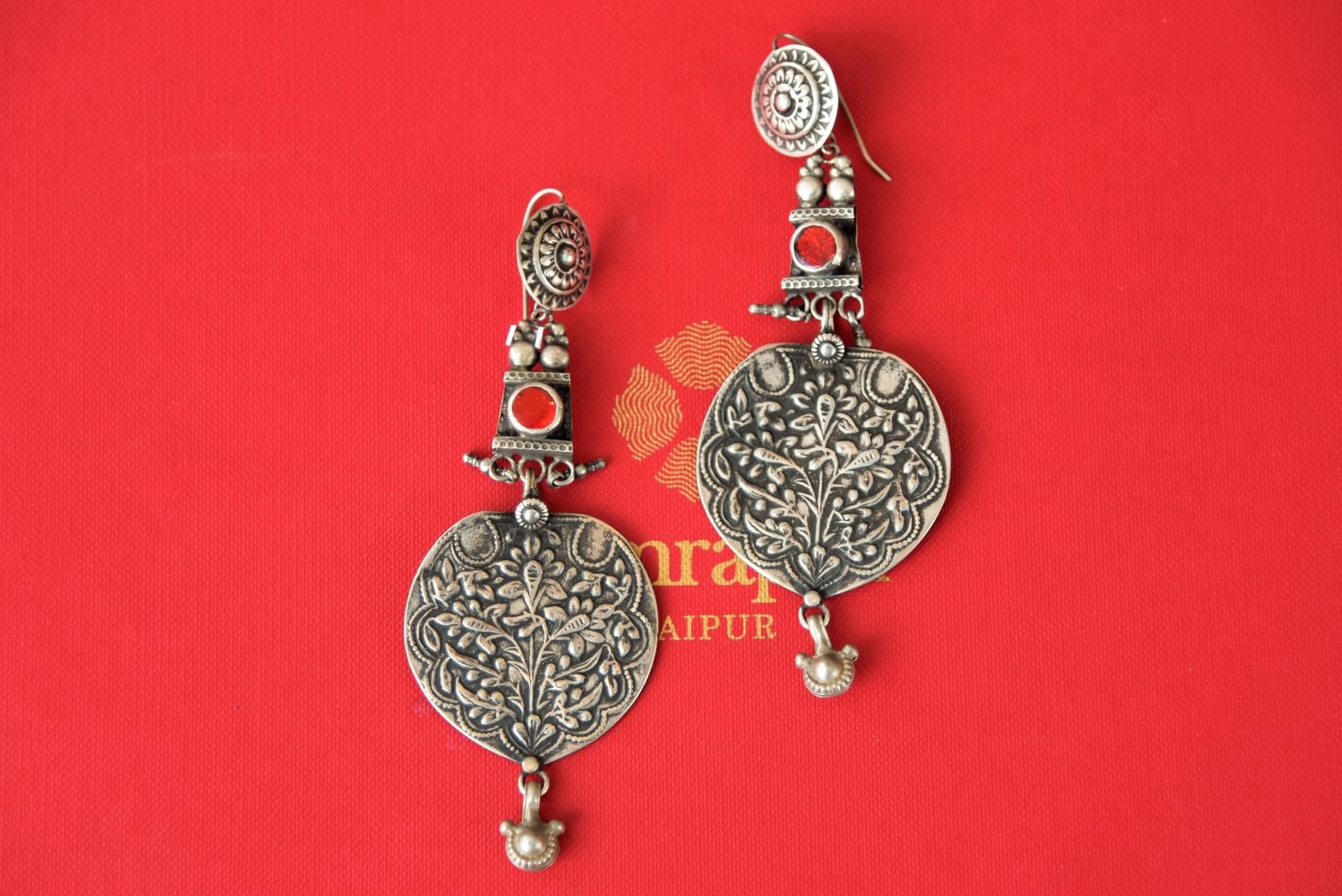 Buy engraved flower design Amrapali oxidized silver earrings online in USA. Enhance your ethnic style with exquisite Indian jewelry from Pure Elegance Indian fashion store in USA. Pick from a range of stunning silver gold plated earrings, silver gold plated necklaces, silver jewelry for a perfect finishing to your...-front