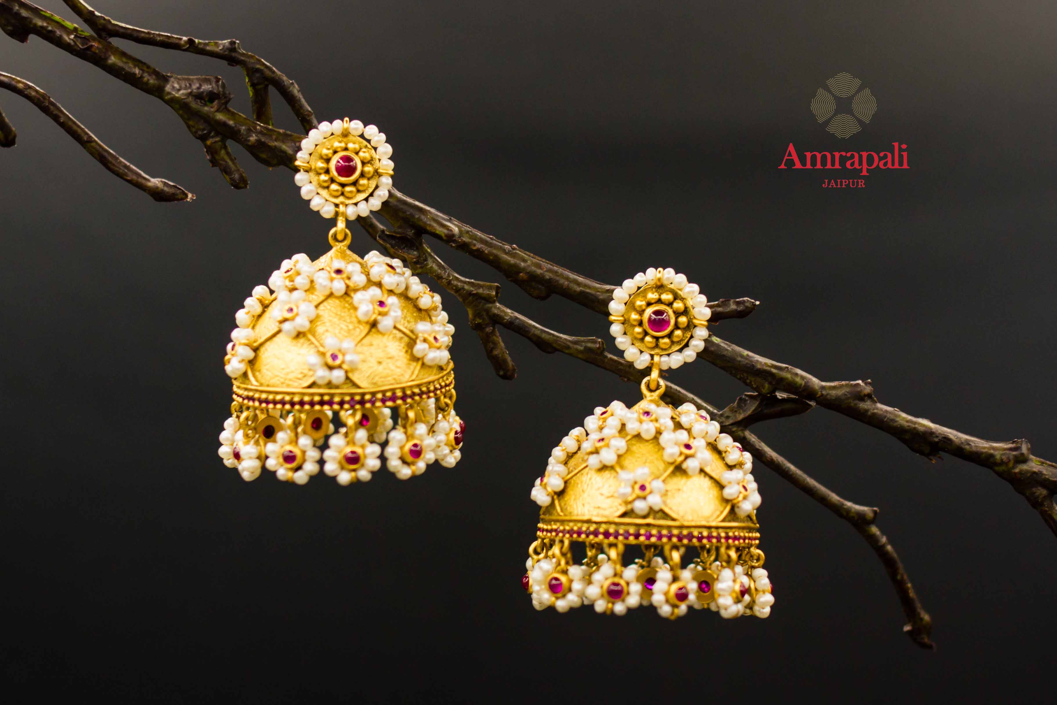 Buy Amrapali silver gold plated pearl flowers jhumka earrings online in USA. Raise your ethnic style quotient on special occasions with exquisite Indian jewelry from Pure Elegance Indian clothing store in USA. Enhance your Indian look with silver gold plated jewelry, necklaces, fashion jewelry available online.-front