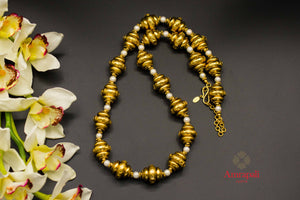 Shop Amrapali silver gold plated beads and pearls necklace online in USA. Raise your ethnic style quotient on special occasions with exquisite Indian jewelry from Pure Elegance Indian clothing store in USA. Enhance your Indian look with silver gold plated jewelry, necklaces, fashion jewelry available online.-flatlay