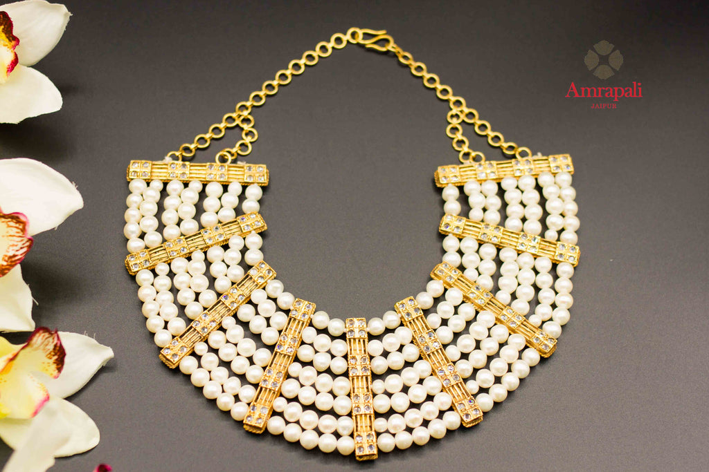 Buy Amrapali silver gold plated multi-strand pearl necklace online in USA. Raise your ethnic style quotient on special occasions with exquisite Indian jewelry from Pure Elegance Indian clothing store in USA. Enhance your Indian look with silver gold plated jewelry, necklaces, fashion jewelry available online.-flatlay