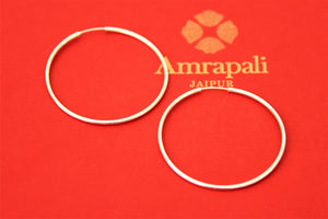 Buy Amrapali classic silver hoop earrings online in USA. Choose from a beautiful range of Indian jewelry, silver jewelry, silver earrings, gold plated jewelry from Pure Elegance Indian fashion store in USA.-flatlay