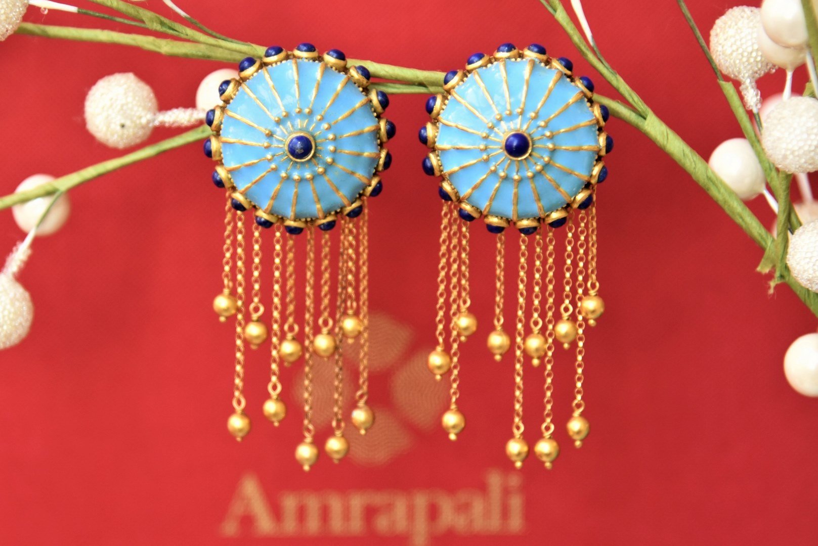 Buy Amrapali silver gold plated blue enamel chakra top earrings online in USA with tassels. Complete your traditional style with exquisite gold plated jewelry from Pure Elegance Indian fashion store in USA.-front