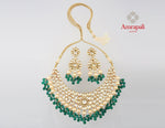 Buy Amrapali gold plated heavy kundan and emerald necklace set online in USA. Complete your traditional style with exquisite gold plated jewelry, silver jewelry, gold plated earrings, wedding jewelry from Pure Elegance Indian fashion store in USA.-front