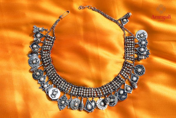 Buy Amrapali silver necklace online in USA with pearl embedded hanging tassels. Enhance your ethnic attires with exquisite Amrapali silver jewelry, silver necklace, silver earrings from Pure Elegance Indian fashion store in USA.-flatlay