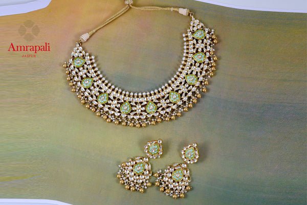 Buy exquisite Amrapali silver gold plated meenakari and glass necklace set online in USA. Enhance your ethnic attires with exquisite Amrapali silver gold plated jewelry, silver gold plated necklace from Pure Elegance Indian fashion store in USA.-flatlay