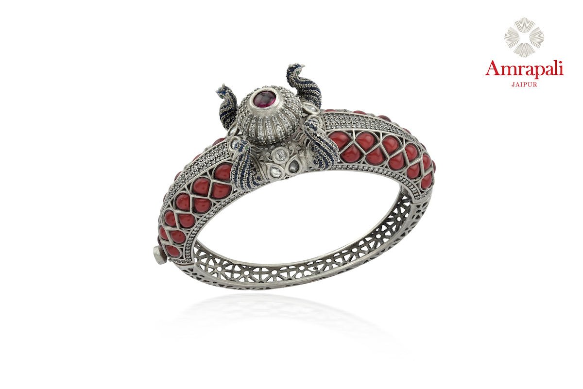 Buy beautiful Amrapali red stone heavy silver bangle online in USA. Enhance your ethnic attires with exquisite Amrapali silver jewelry, silver bangle from Pure Elegance Indian fashion store in USA.-front