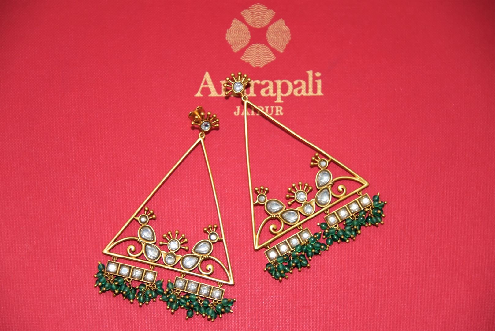 Shop stunning Amrapali silver gold plated triangle shape glass earrings online in USA with green beads. Complete your festive look with exclusive silver gold plated jewelry, gold plated earrings, silver jewelry, silver earrings from Pure Elegance Indian fashion store in USA.-front