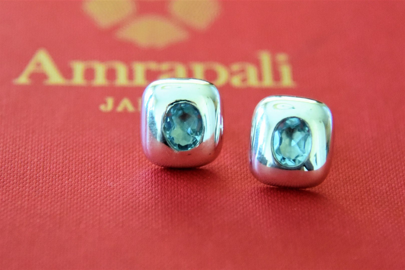 Buy stunning Amrapali blue stone silver studs online in USA. Complete your festive look with exclusive silver gold plated jewelry, gold plated earrings, silver jewelry, silver earrings from Pure Elegance Indian fashion store in USA.-front