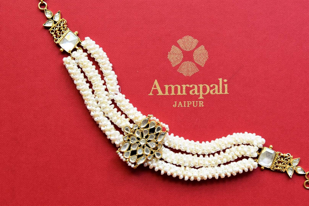 Shop stunning silver gold plated glass and pearl bracelet online in USA. Complete your festive look with exclusive silver gold plated jewelry, gold plated earrings, silver jewelry, silver earrings from Pure Elegance Indian fashion store in USA.-flatlay