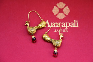 Shop beautiful silver gold peacock earrings online in USA with red stone drops. Complete your festive look with exclusive silver gold plated jewelry, gold plated earrings, silver jewelry, silver earrings from Pure Elegance Indian fashion store in USA.-flatlay