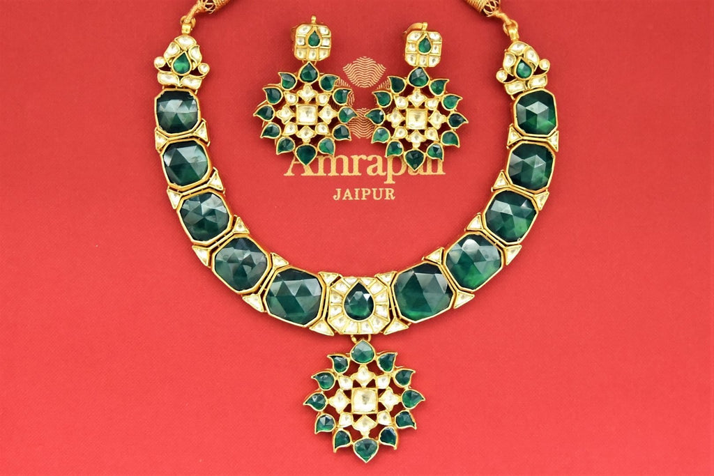 Buy stunning silver gold plated green stones statement necklace set online in USA. Buy exclusive Indian jewelry, gold plated earrings, silver earrings, gold plated necklace from Amrapali in USA available at Pure Elegance Indian fashion store.-flatlay