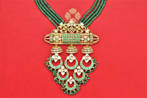 Buy stunning gold plated pendant necklace online in USA with green stone string. Shop beautiful Amrapali jewelry, gold plated necklaces, silver jewelry, wedding jewelry, gold plated earrings from Pure Elegance Indian fashion store in USA.-front