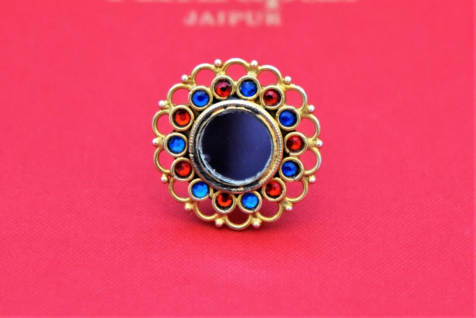 Buy stunning Amrapali gold plated mirror ring online in USA with blue and red stones. Shop beautiful Amrapali jewelry, gold plated necklaces, silver jewelry, wedding jewelry, gold plated earrings from Pure Elegance Indian fashion store in USA.-front