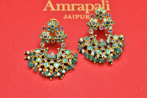 Shop stunning gold plated green stones chandbali earrings online in USA. Shop beautiful Amrapali jewelry, gold plated necklaces, silver jewelry, wedding jewelry, gold plated earrings from Pure Elegance Indian fashion store in USA.-front