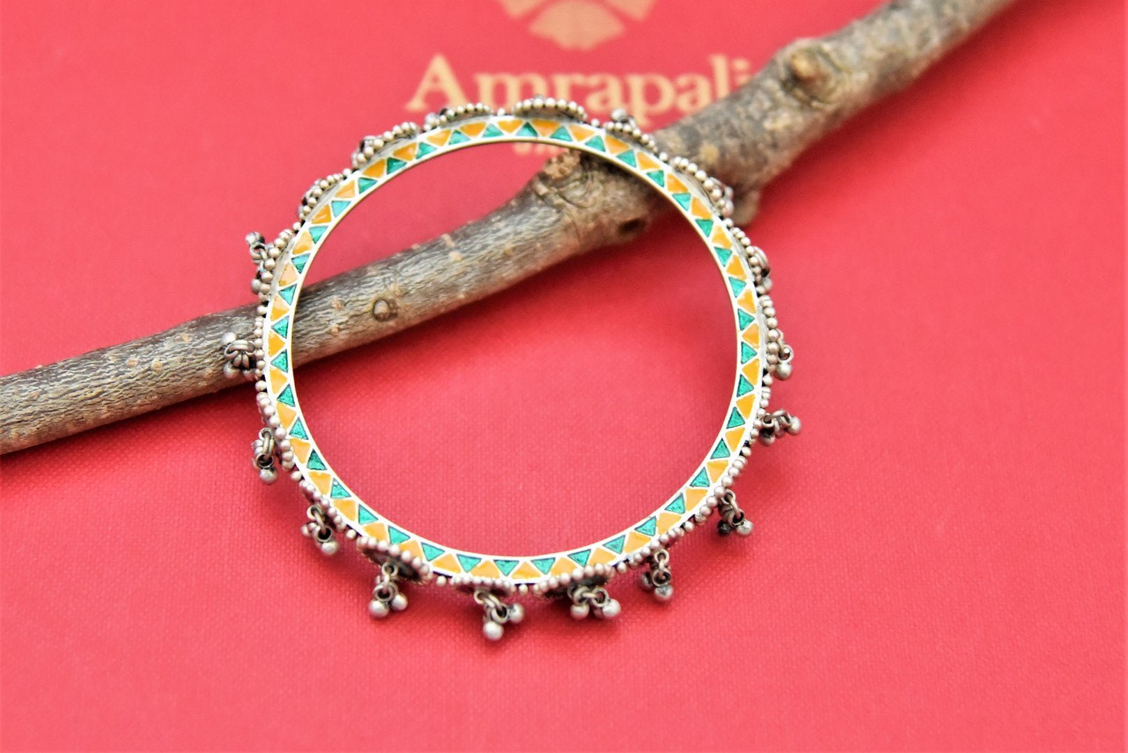 Buy Amrapali stunning enamel work and silver ghungroo bangle online in USA. Shop beautiful Amrapali jewelry, gold plated necklaces, silver jewelry, wedding jewelry, gold plated earrings from Pure Elegance Indian fashion store in USA.-front