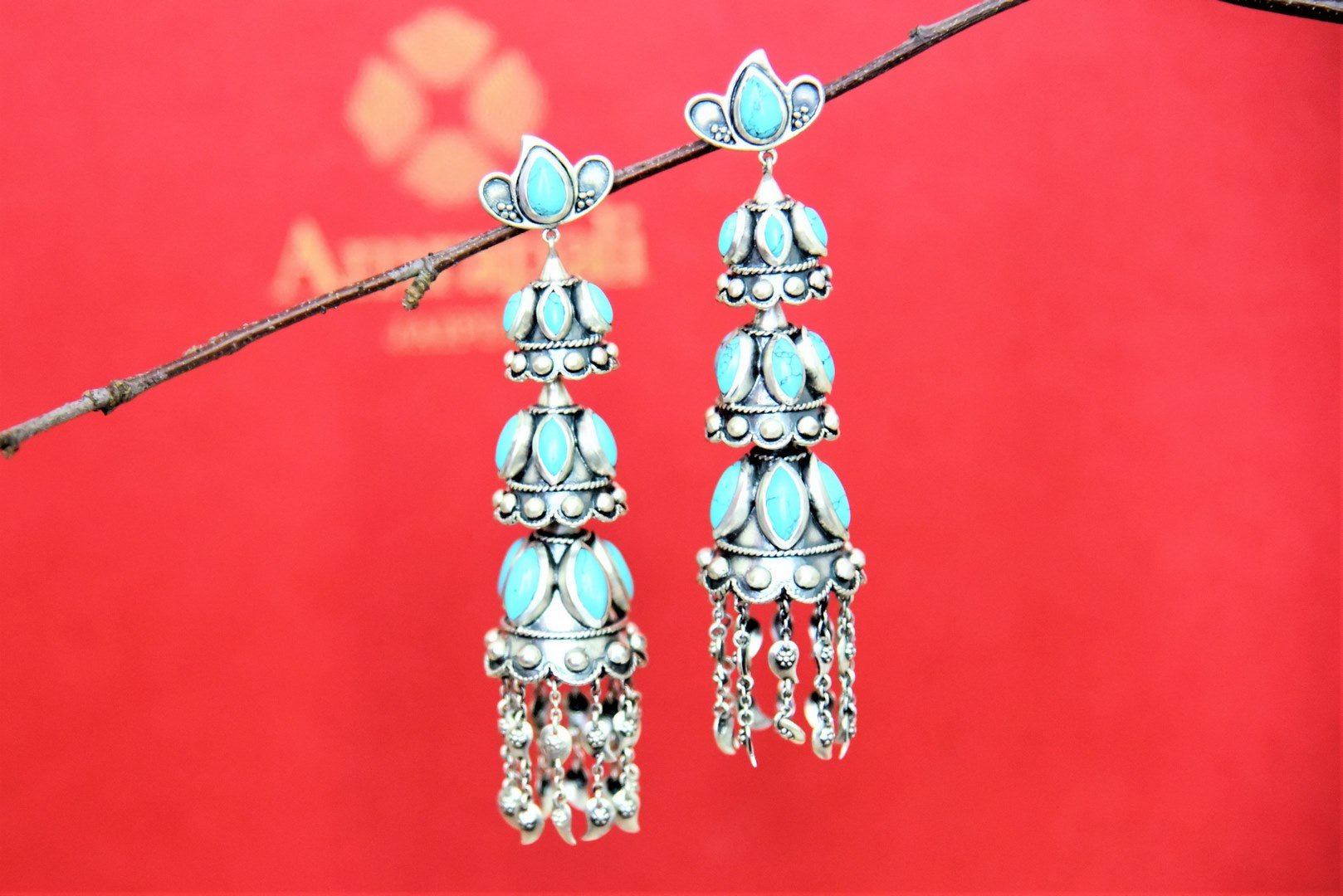 Shop beautiful silver layered jhumki earrings online in USA with turquoise stones. Look beautiful in Indian jewelry, gold plated jewelry , silver jewelry, gold plated earrings, wedding jewellery from Pure Elegance Indian fashion store in USA.-full view