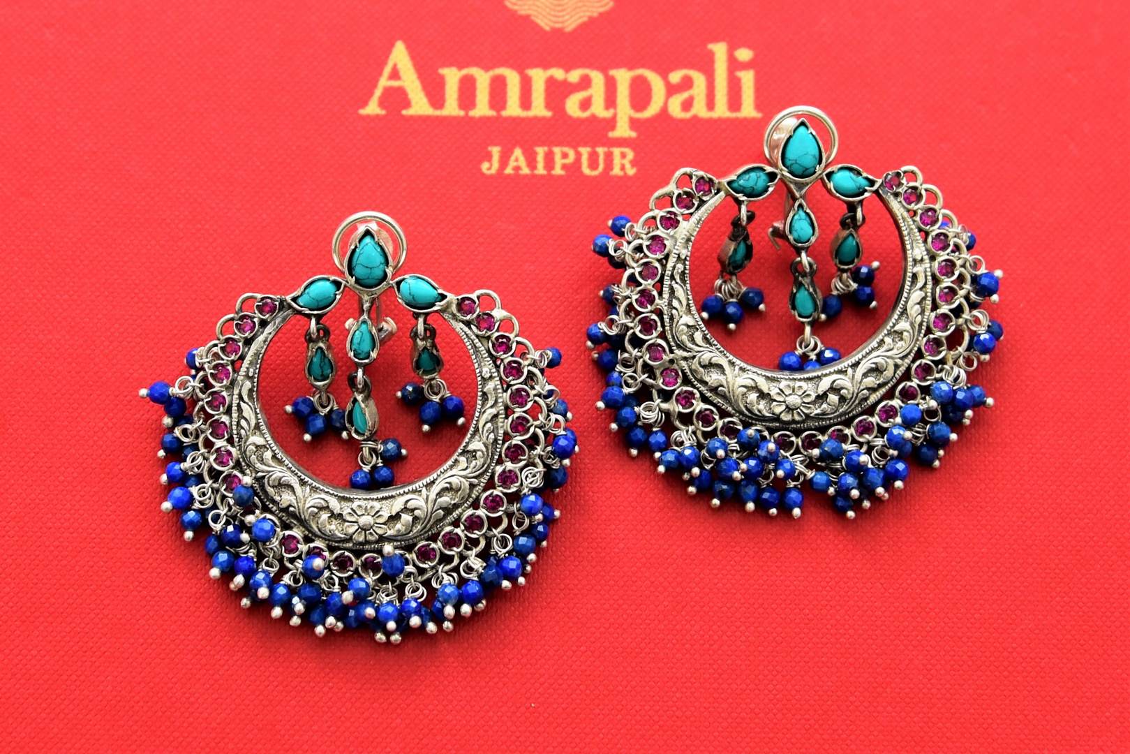 Buy beautiful silver chandbali earrings online in USA with blue stones. Shop gold plated jewelry, silver jewelry,  silver earrings, bridal jewelry, fashion jewelry from Amrapali from Pure Elegance Indian clothing store in USA.-full view