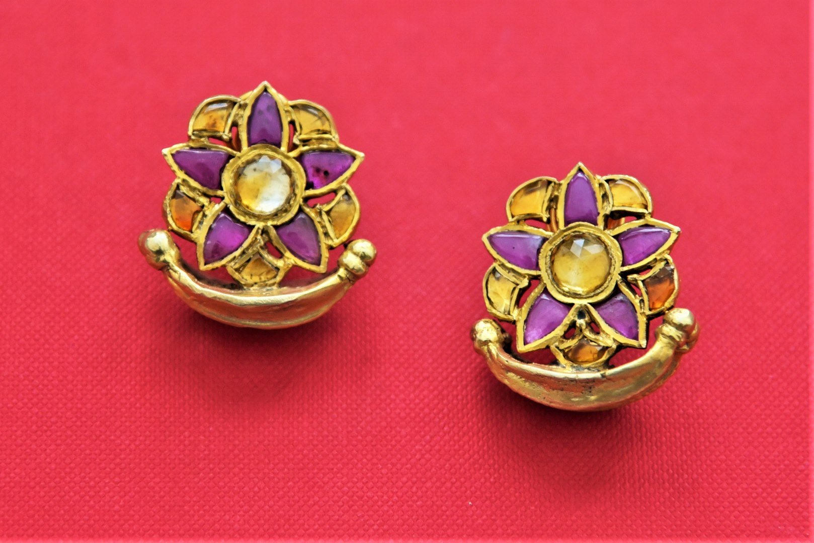 Buy beautiful purple and yellow stone floral gold plated studs online in USA. Add an elegant touch to your style with gold plated necklace, silver jewelry, wedding jewelry, gold plated earrings in USA from Pure Elegance Indian fashion store in USA.-full view
