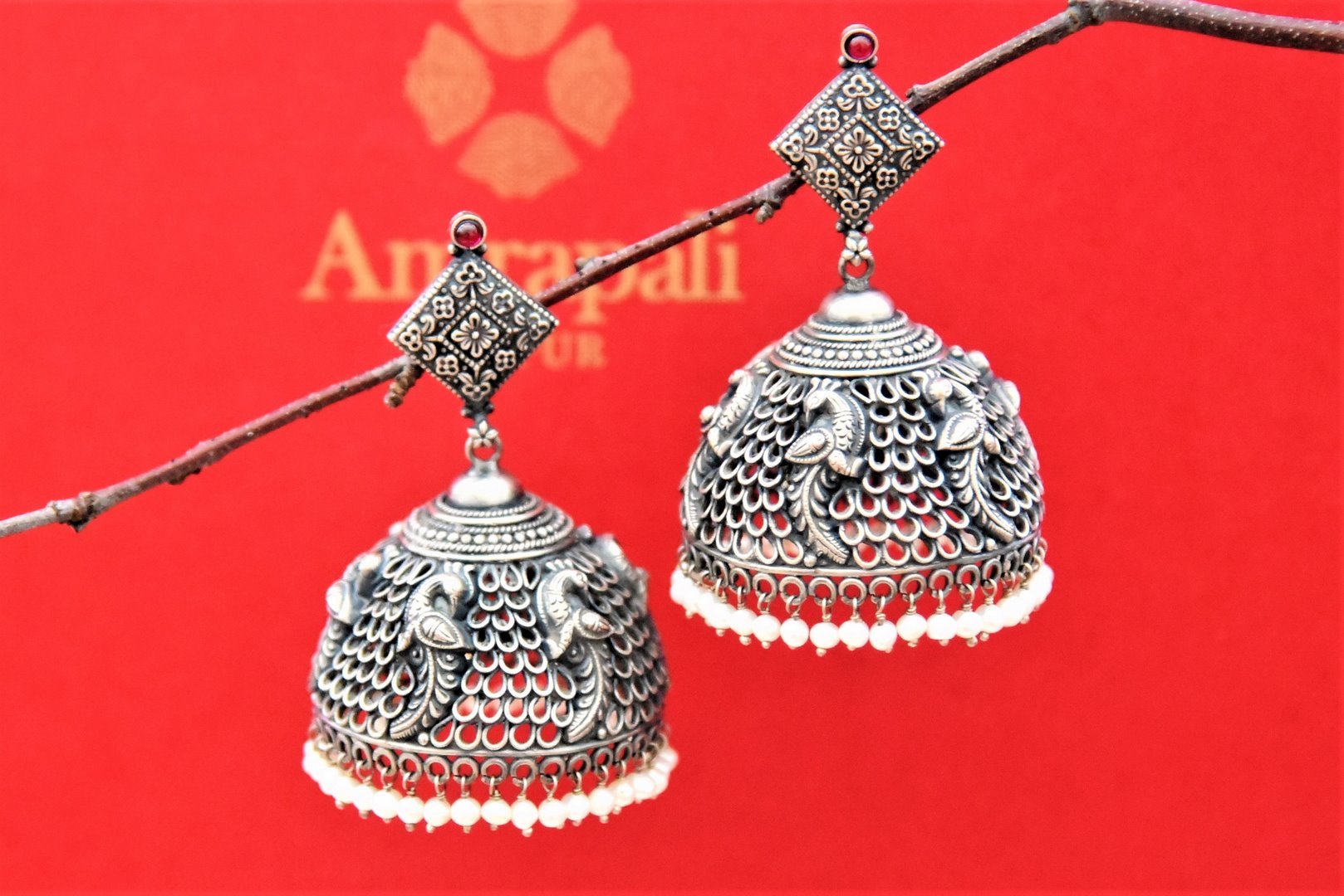 Shop stunning silver peacock heavy jhumka earrings online in USA. Shop gold plated jewelry, silver jewelry,  silver earrings, bridal jewelry, fashion jewelry from Amrapali from Pure Elegance Indian clothing store in USA.-full view