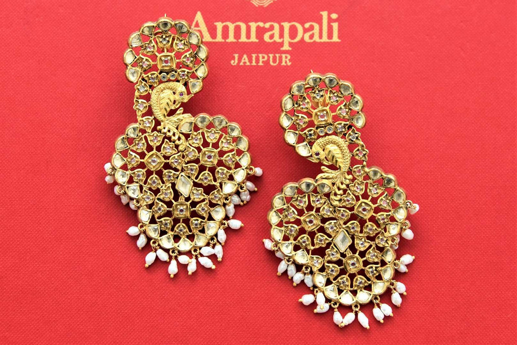 Buy stunning gold plated glass peacock design earrings online in USA with pearls. Shop gold plated jewelry, silver jewelry,  silver earrings, bridal jewelry, fashion jewelry from Amrapali from Pure Elegance Indian clothing store in USA.-full view