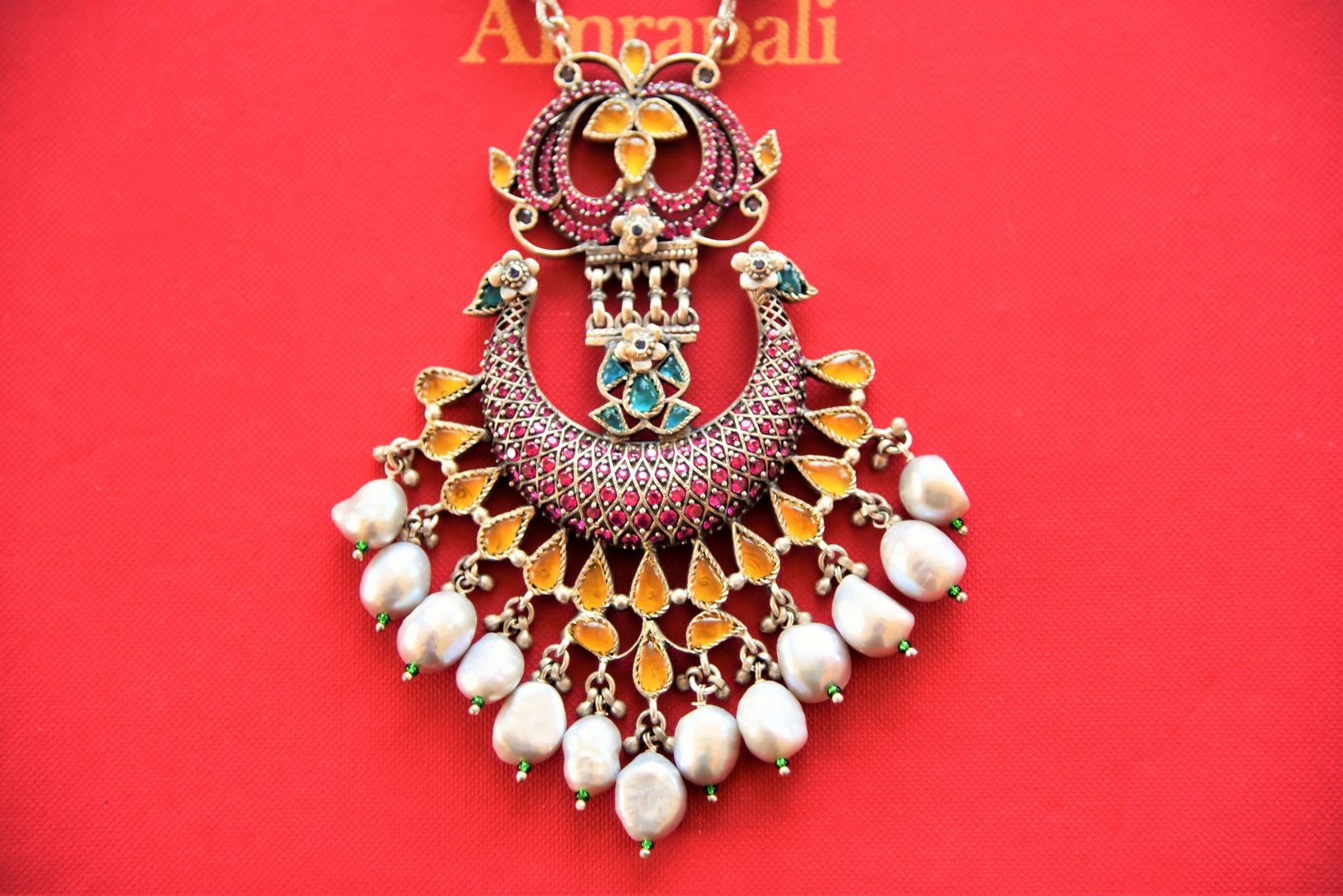 Buy beautiful pearl strings necklace online in USA with multicolor stone Pendant. Shop exclusive gold plated jewelry, wedding jewelry , bridal jewelry, gold plated earrings, silver jewelry from Amrapali at Pure Elegance Indian fashion store in USA.-pendant