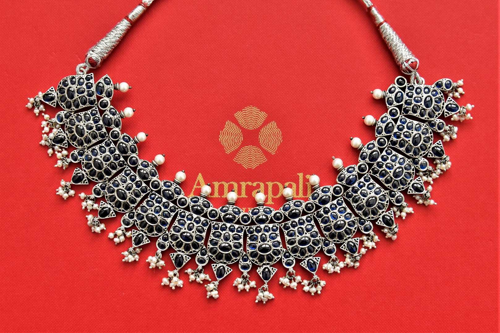 Shop stunning blue stone silver necklace online in USA with pearl beads. Add an elegant touch to your style with gold plated necklace, silver jewelry, wedding jewelry, gold plated earrings in USA from Pure Elegance Indian fashion store in USA.-full view
