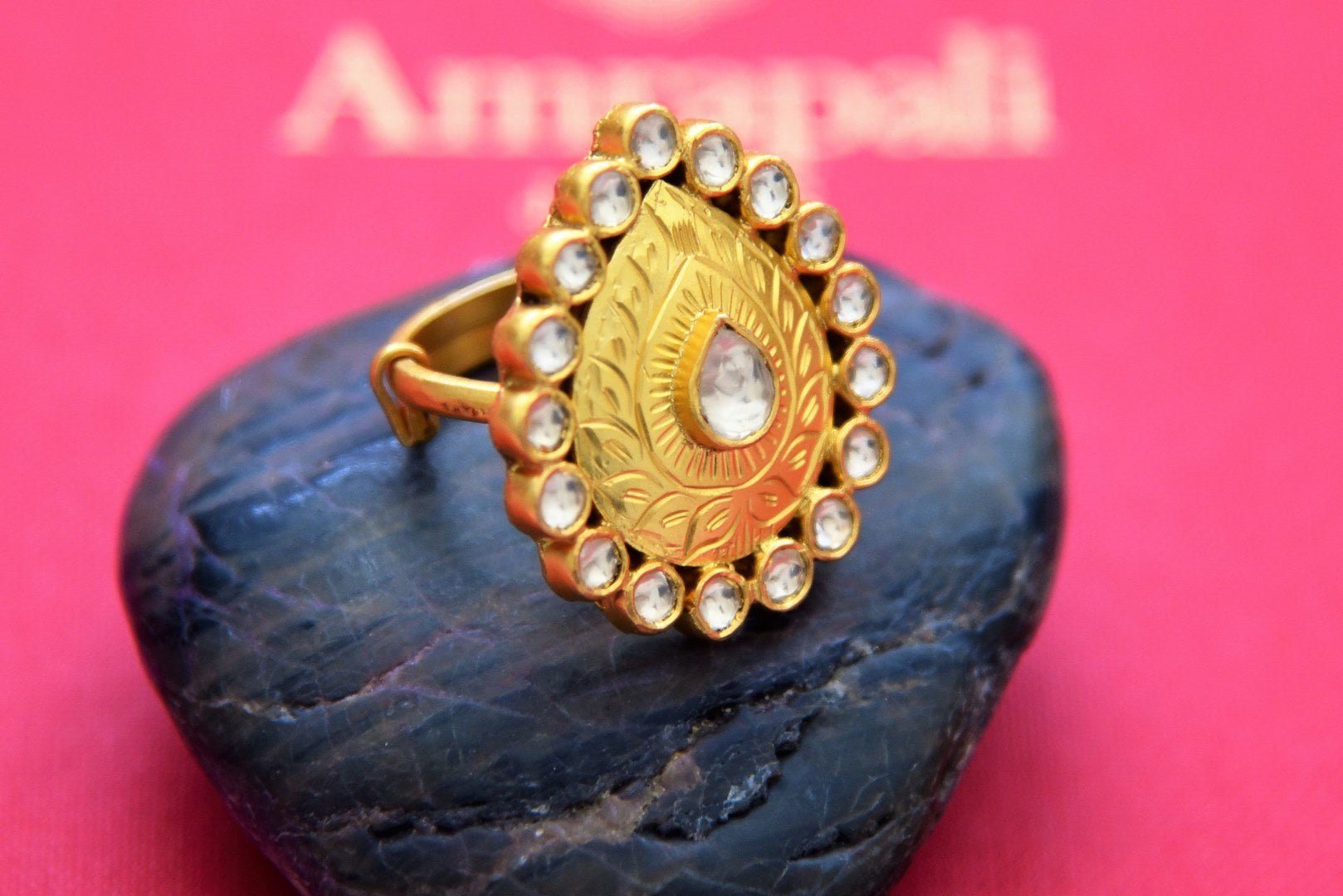 Shop stunning Amrapali gold plated kundan ring online in USA with green stone. Shop beautiful gold plated jewelry, kundan jewelry, bridal jewelry, silver jewelry in USA from Pure Elegance Indian fashion store in USA.-full view