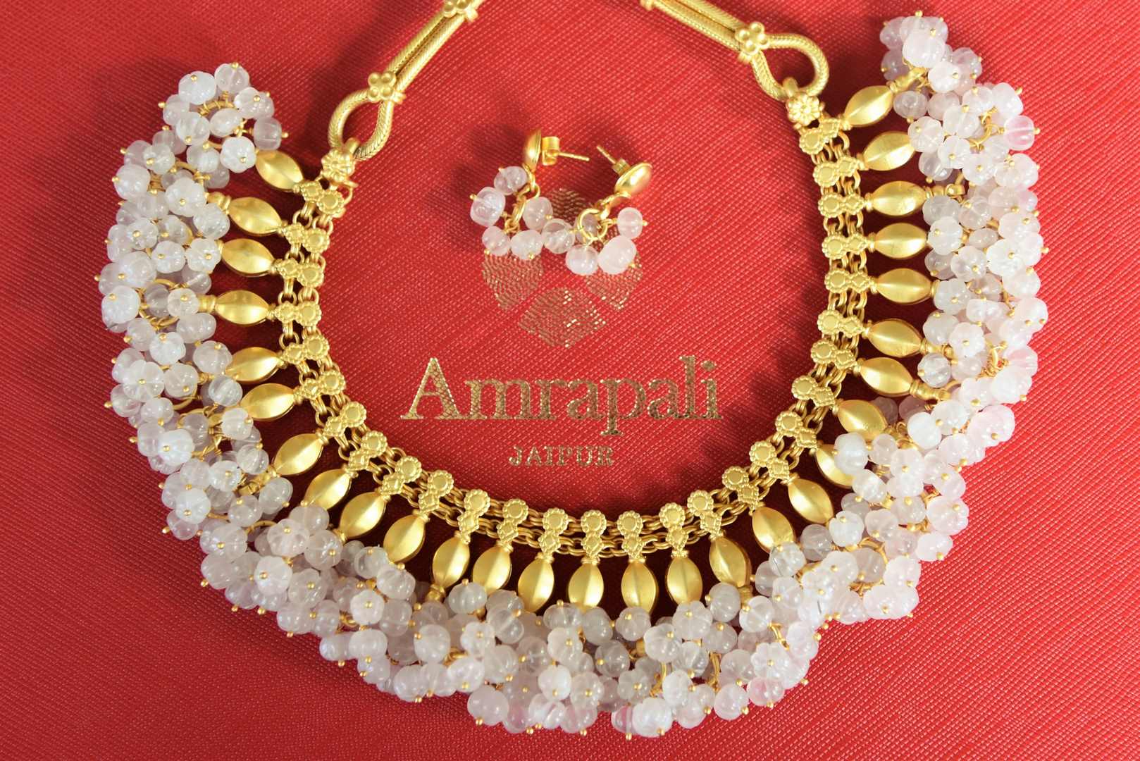 Buy Amrapali gold plated necklace set online in USA with white beads. Shop exclusive gold plated jewelry, wedding jewelry , bridal jewelry, gold plated earrings, silver jewelry from Amrapali at Pure Elegance Indian fashion store in USA.-full view