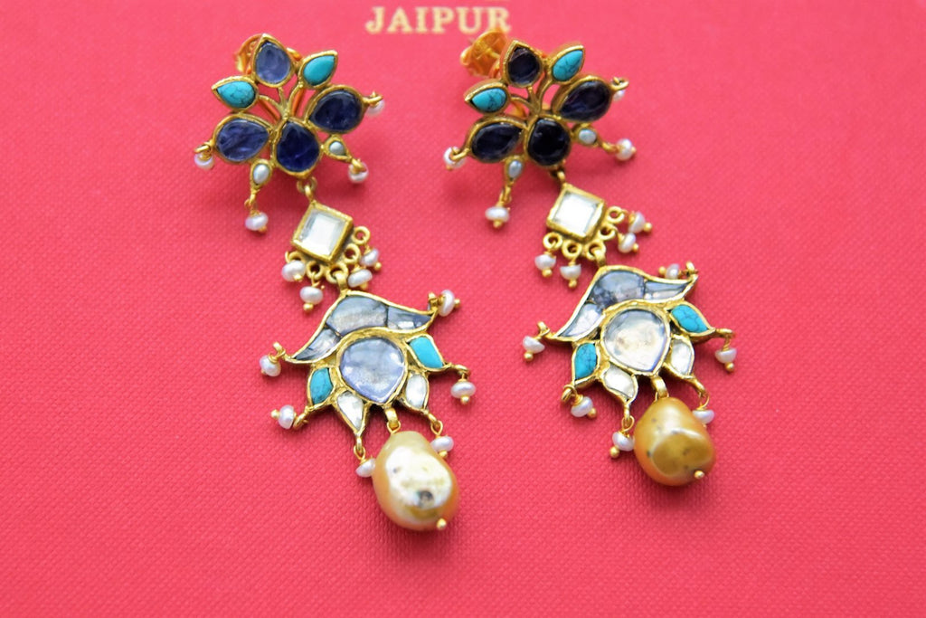 Buy shaded blue stones gold plated floral dangler earrings online in USA. Add a beautiful spark to your ethnic style with gold plated jewelry, silver jewelry, gold plated earrings, wedding jewelry, silver necklaces from Pure Elegance Indian fashion store in USA.-full view
