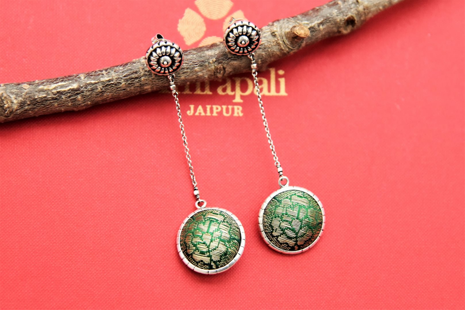 Buy Amrapali silver earrings online in USA with green fabric ball. Buy beautiful silver jewelry, gold plated jewelry, silver earrings, wedding jewelry from Pure Elegance Indian fashion store in USA. -full view