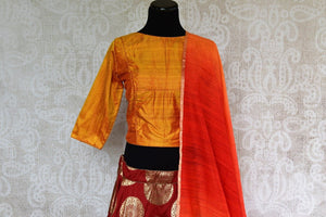 Pure Elegance store brings stylish Indowestern dresses online in USA. Buy elegant red Banarasi skirt with gold yellow raw silk blouse online for Indian festivals and other occasions.-top