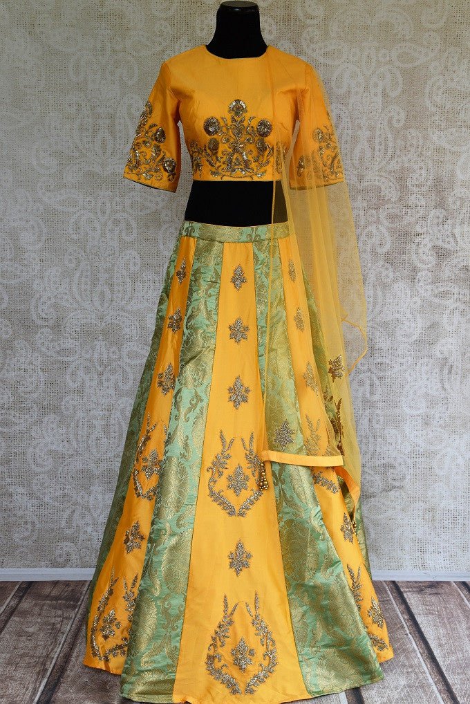Buy online designer yellow silk and Banarasi embroidered lehenga with blouse and dupatta .  Pure Elegance store brings traditional Indian dresses online in USA.-full view