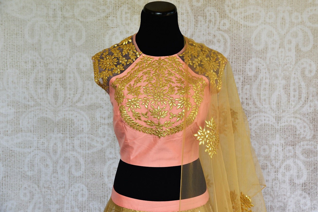 Buy online designer gold Banarasi skirt with peach gota patti blouse with net dupatta .  Pure Elegance store brings Indian formal dresses online in USA for every occasion.-blouse