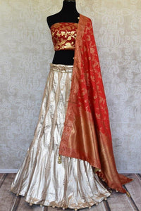 Buy gold Banarasi silk Lehenga with red blouse piece and dupatta online in USA.  Pure Elegance store brings exquisite range of Indian designer lehenga online in USA.-full view