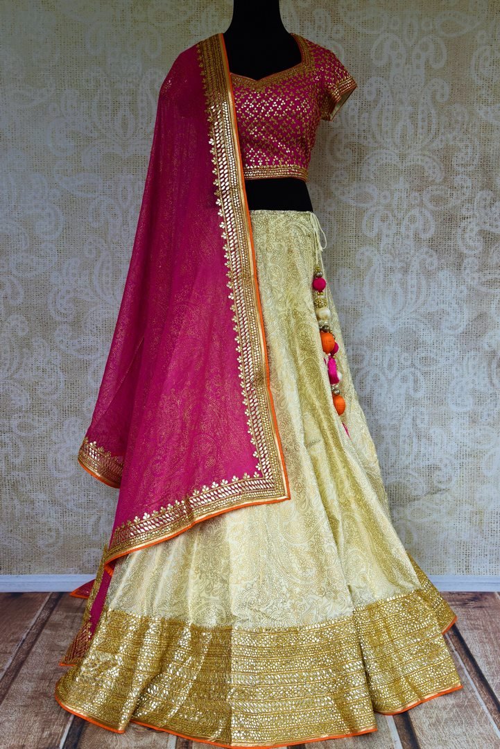 Buy pink and cream embroidered lehenga choli online from Pure Elegance with dupatta. Our Indian fashion store brings stunning desginer wedding lehengas in USA.-full view